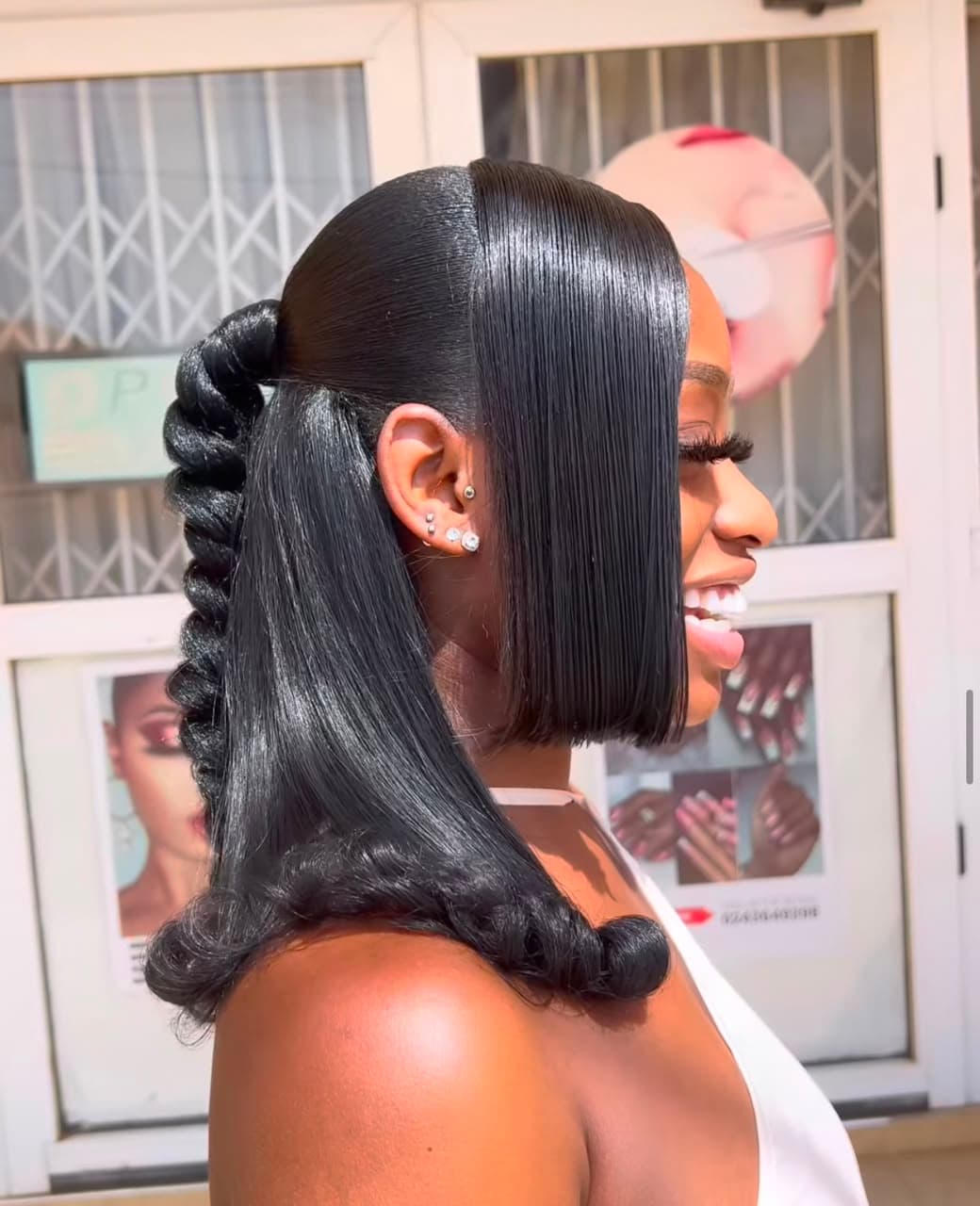 Sleek ponytail being gathered